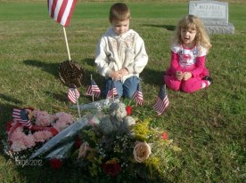 Kids at dads gravesite